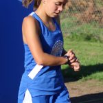 Olympics Brynn Fulton does a time check after crossing the finish line.