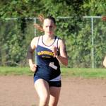 Bainbridges trio of runners Mairin OBrien, Sabine Hartenstine and Evelyn Shutske lead the way in the 2A Olympic League opener.