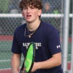 Bainbridges Topher Welch approaches the net right as a serve comes in from the opposite side.
