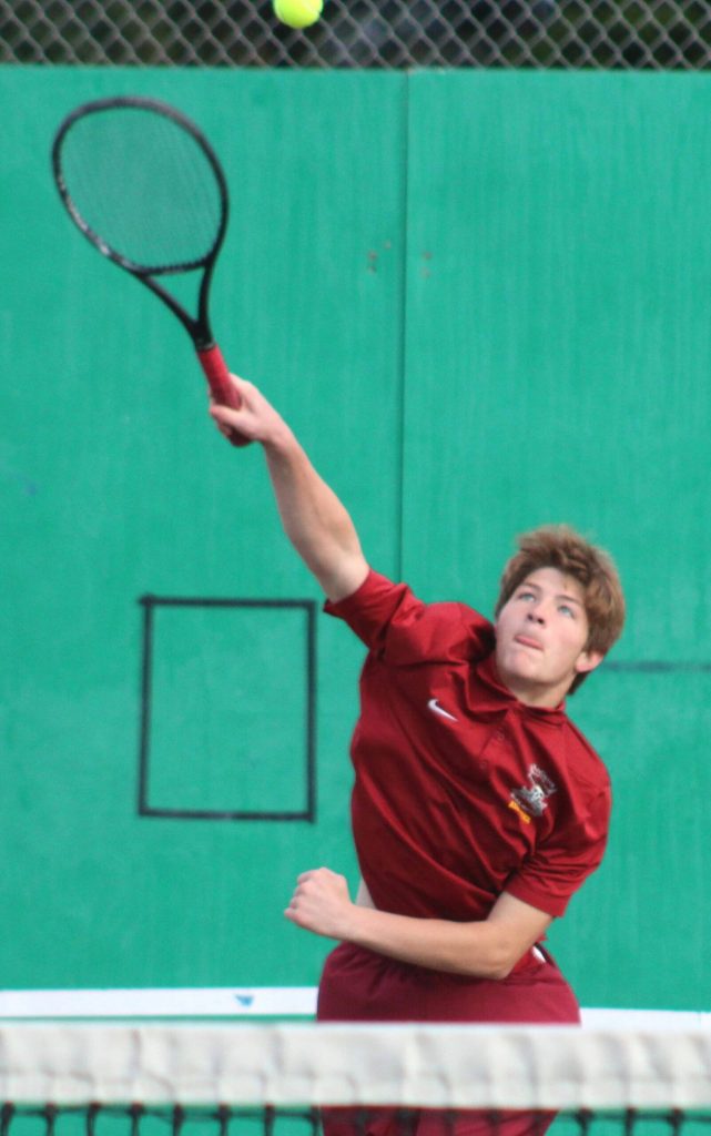 Kingstons Joshua Vanhuis makes a serve in the first match of the league tournament.