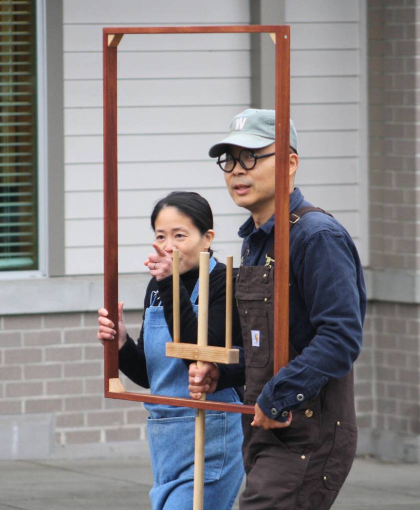 A mobile version of historic 1930 painting 'American Gothic' by Grant Wood.