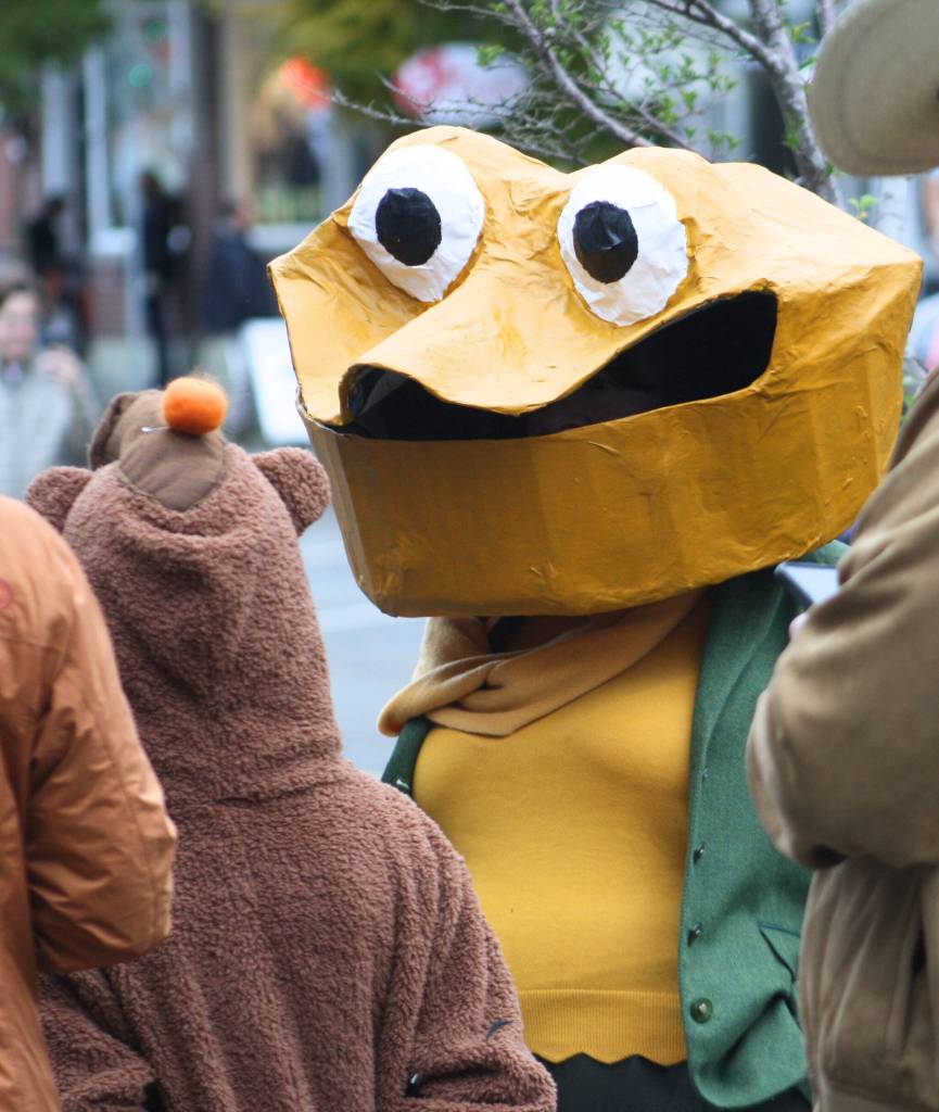Toad, of Frog and Toad fame, smiles at a passerby.