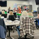 Britney Fletcher-West/Kitsap News Group
Election workers organize ballots at the new elections office in Bremerton.