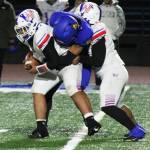 Knight Marquise Allen wraps up the Washington quarterback for a sack at the end of the first half.