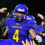 Elisha Meyer/Kitsap News Group
Junior Marquise Allen (No. 4) sprints into a crowd of teammates and Bremerton students to celebrate the Knights walk-off touchdown Nov. 5