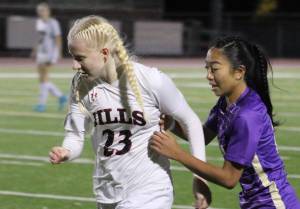 Elisha Meyer/Kitsap News Group
North Kitsap junior Addy Jueco tries to get the ball from a Lumberjills player in the first half of the Vikings state opener.