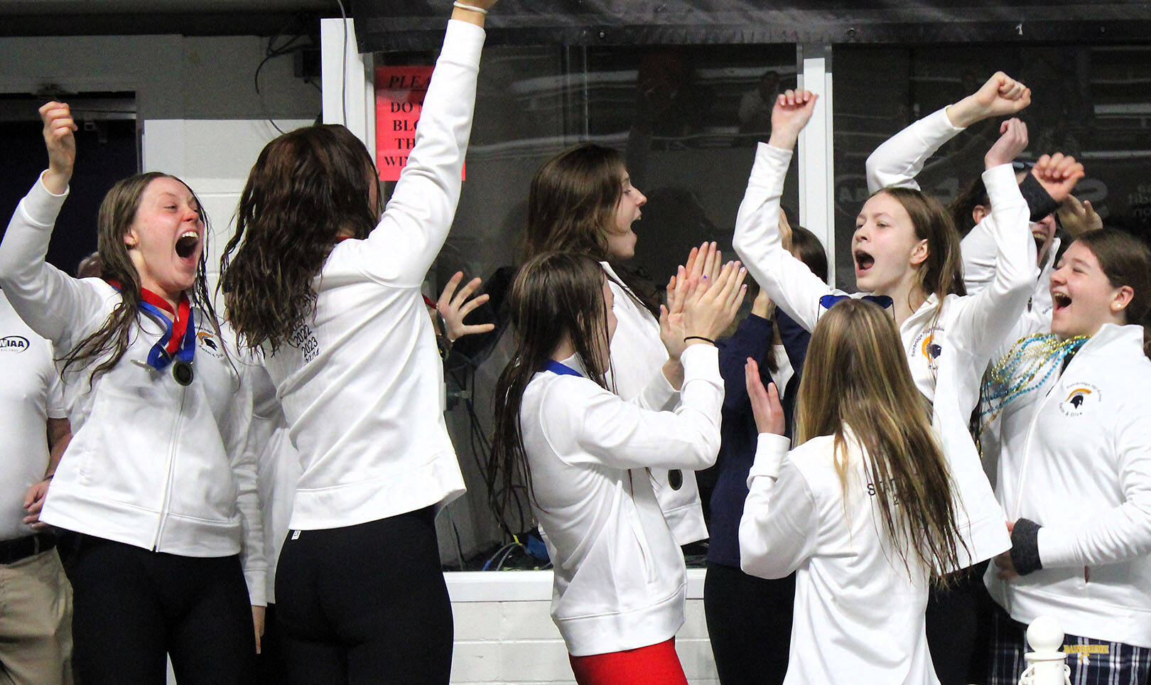 Elisha Meyer/Kitsap News Group photos
Bainbridge swimmers rejoice after officials announce the Spartans won their first WIAA state championship since 2021.