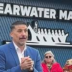 Port Madison Enterprises CEO Rion Ramirez speaks at the grand opening of the market.