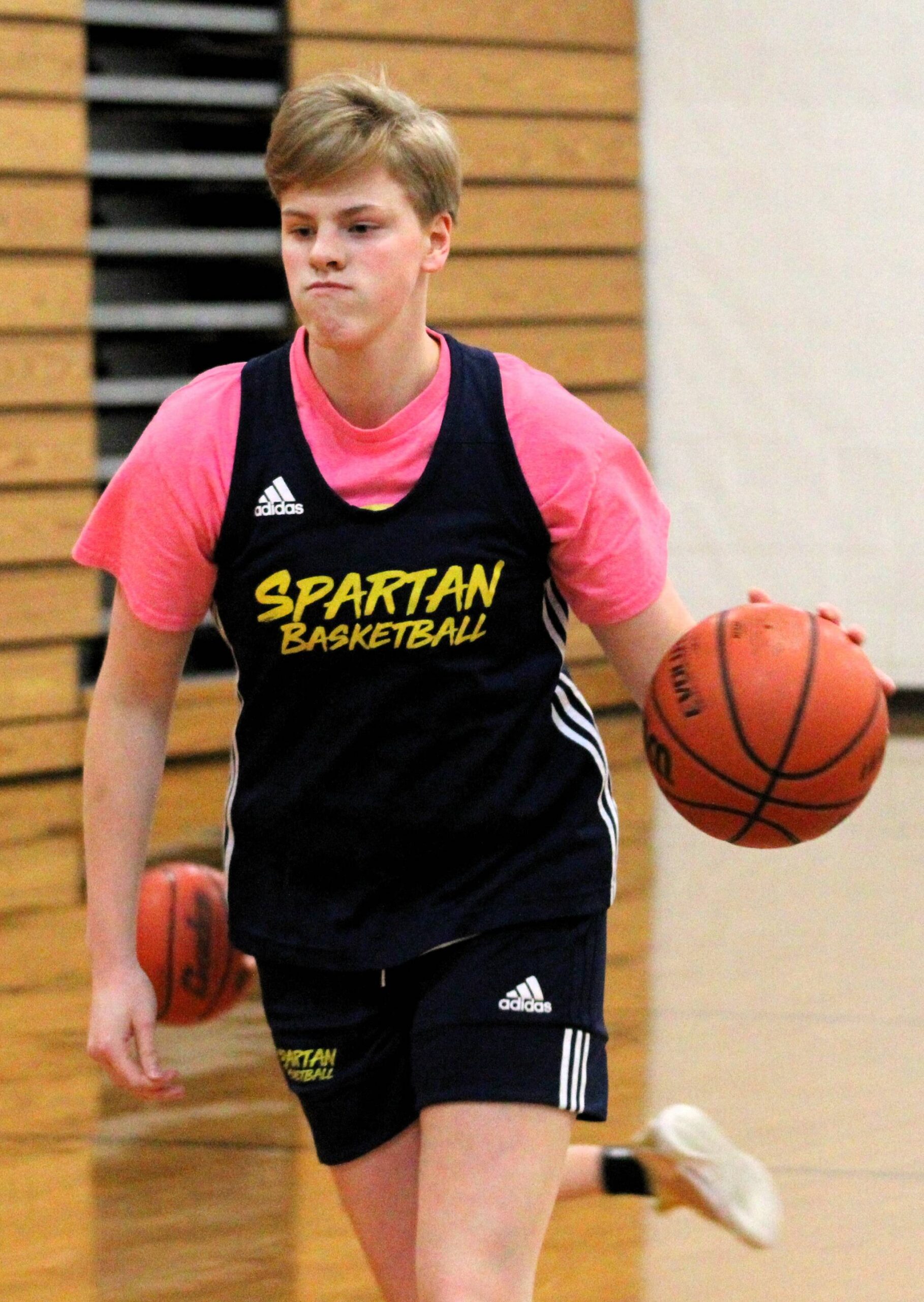 Bainbridge sophomore Anna Rowe dribbles down the court.