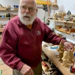 Christmas House courtesy photos
Bob Pedersen with some of the items in Christmas House.