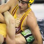Kingstons Bobby Reece III works for the fall during the championship match against East Valleys Braydan Berezay in the Tacoma Dome. Reece won his second 2A State wrestling title in the 152-pound division in 2012.