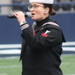 Musician 2nd Class Elizabeth Wetzel sings the National Anthem at Lumen Field prior to the 24th annual Army-Navy flag football game.