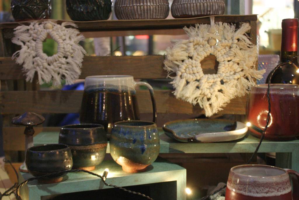 Ceramic art for sale with a snowflake theme at the Winter Night Market.