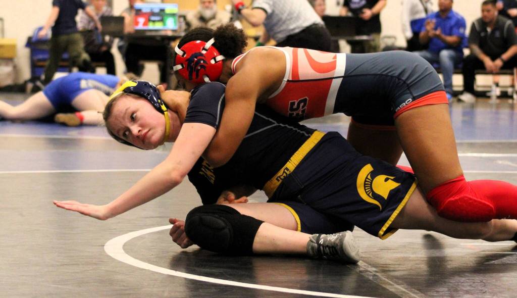 Bainbridges Sam Bonifield tries to avoid getting pinned in her first match.