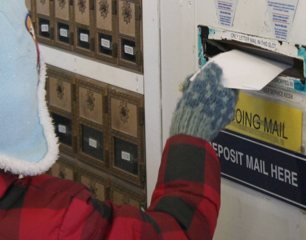 Once they arrived at the post office, those who wrote letters placed them in the mail slot.