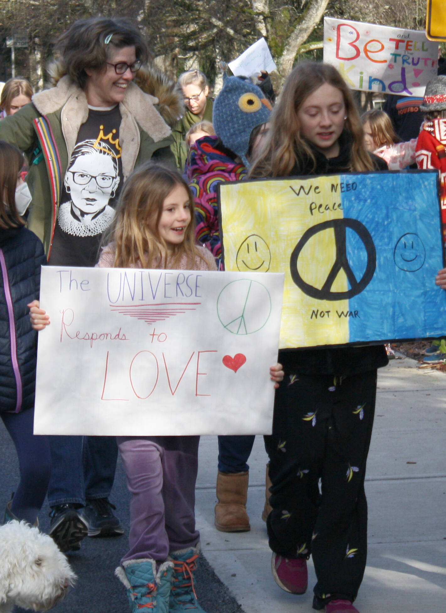 Youth incorporated peace symbols and imagery of love and positivity on their posters.
