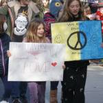 Youth incorporated peace symbols and imagery of love and positivity on their posters.
