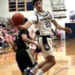 Spartan junior Kaden Thielman grabs a rebound in the win against Sequim Jan. 24.
