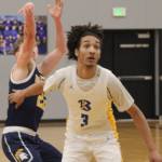Bremerton Knight senior Frank Allen boxes out Bainbridge senior Luke Johnson after the Spartans three-pointer Jan. 28.
