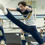 BHS Cheer courtesy photos
Matthew Knight performs a leaping high kick during a cheer routine.