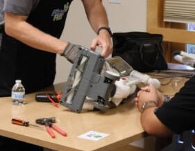 Kitsap County courtesy photo
A Fix-It Fair attendee patiently waits to get their KitchenAid standing mixer repaired.