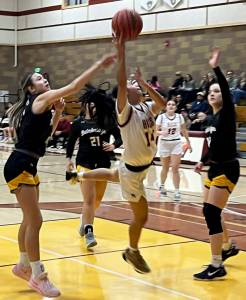 Luke Caputo/Kitsap News Group photos
Kingston junior Tati Fontes-Lawrence goes in for a contested layup in a 69-36 loss to Bainbridge Jan. 31 at Kingston High School.