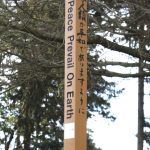 The pole features the phrase May Peace Prevail on Earth in four languages on each side of the pole.