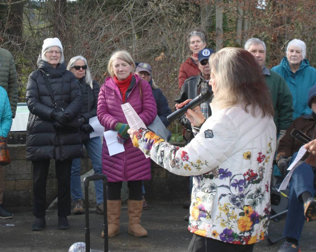 Nancy Houghton, member of the BI Rotary Club and organizer of the event, speaks at the ceremony.