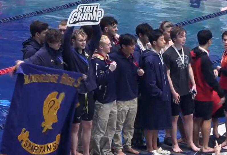 Luke Caputo/Kitsap News Group
The Bainbridge Spartans celebrate their state victory at the 1A-2A swimming championships at the King Aquatic Center Feb. 22.