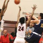 Rohrbacher of Bainbridge tries to pass out of a double-team in a 47-41 loss to the Franklin Pierce Cardinals Feb. 28 at the University of Puget Sound in Tacoma.