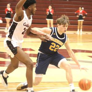Luke Caputo/Kitsap News Group photos
Bainbridge Spartan Luke Johnson evades a defender in a 47-41 loss to the Franklin Pierce Cardinals Feb. 28 at the University of Puget Sound in Tacoma.