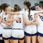 The Spartans huddle up as a team at the 2A girls state basketball tournament in Yakima.