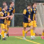 The Spartans celebrate a goal against Skyline March 20 at Bainbridge High School.