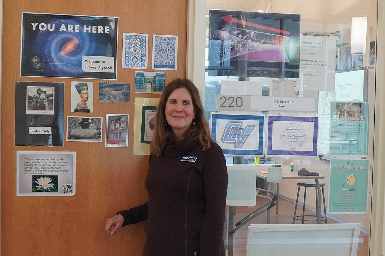 Cathy DeLorey stands outside of her classroom.