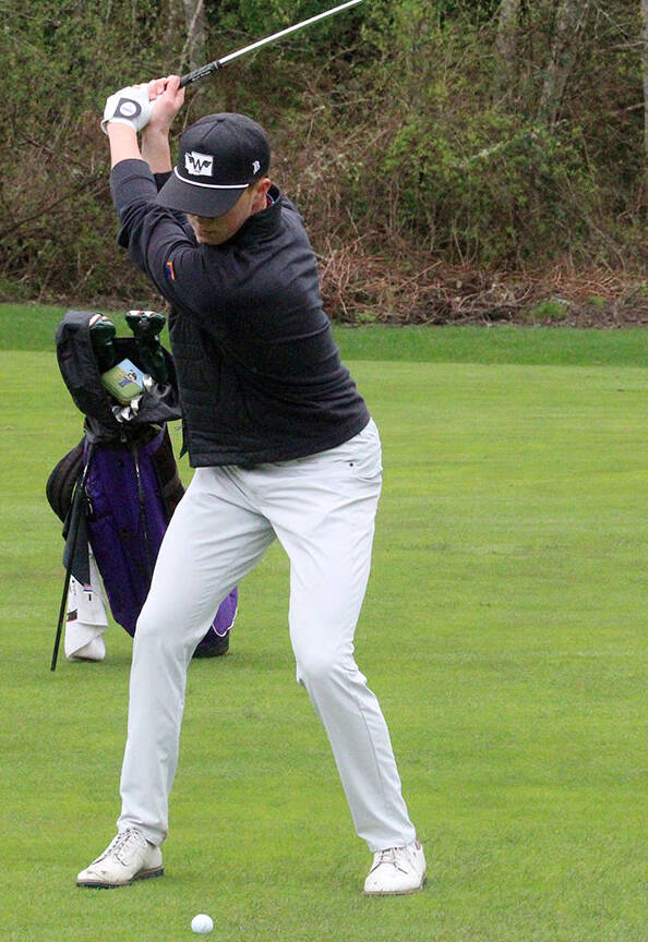 Spartan Anderson Wicklund hits his approach shot in a Bainbridge win over the North Kitsap Vikings March 27. He shot one over par through nine holes.