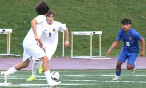 Luke Caputo/Kitsap News Group photos
Spartan junior Cruz Piland and Knight junior Luis Funez Ramos in pursuit of the ball in a 10-1 Bainbridge victory over the Knights March 28 at Bremerton High School.