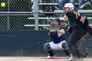 Luke Caputo/Kitsap News Group photos
Buccaneer Brooke Steele eyes an incoming pitch in a 19-0 Kingston win over the Bainbridge Spartans March 31 at Bainbridge High School.