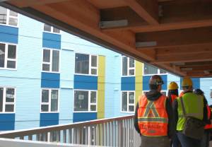 Molly Hetherwick/Kitsap News Group photos
LIHI teams talk to BI city leaders at one of their newest apartment buildings in Rainier Valley, currently under construction.