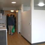 A studio unit is refreshed for a new tenant in LIHIs George Fleming Place, with a built-in dividing wall between the common space and the bedroom.