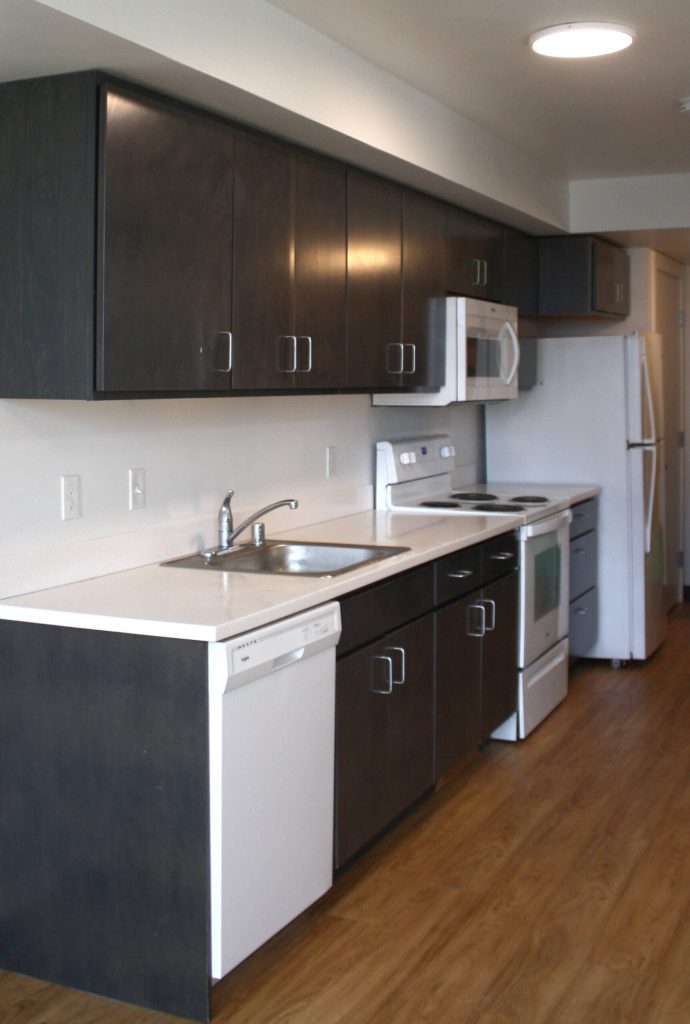 The kitchen of a studio unit in LIHIs George Fleming Place.