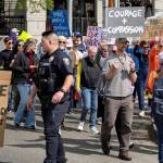 Jello Penguin Productions courtesy photos
Marchers round the corner at Winslow Way and Madison Avenue, with police directing traffic.