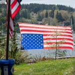 An American flag suspended upside down, the international sign for distress.