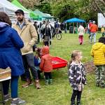 File photos
Numerous Earth Day booths were set up at Battle Point Park on Bainbridge Island last year to talk to visitors about the environment.