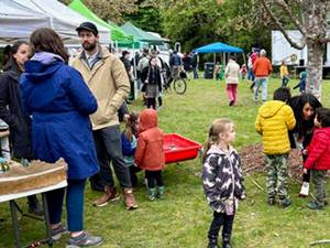 File photos
Numerous Earth Day booths were set up at Battle Point Park on Bainbridge Island last year to talk to visitors about the environment.