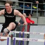 Luke Caputo/Kitsap News Group photos
Viking Theo Sterns, left, competes in a hurdling event with a Bainbridge runner on his heels April 19 at the Lil Norway Invitational track meet at North Kitsap High School.