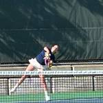 Combs hits a serve in a match against Sequim April 24.