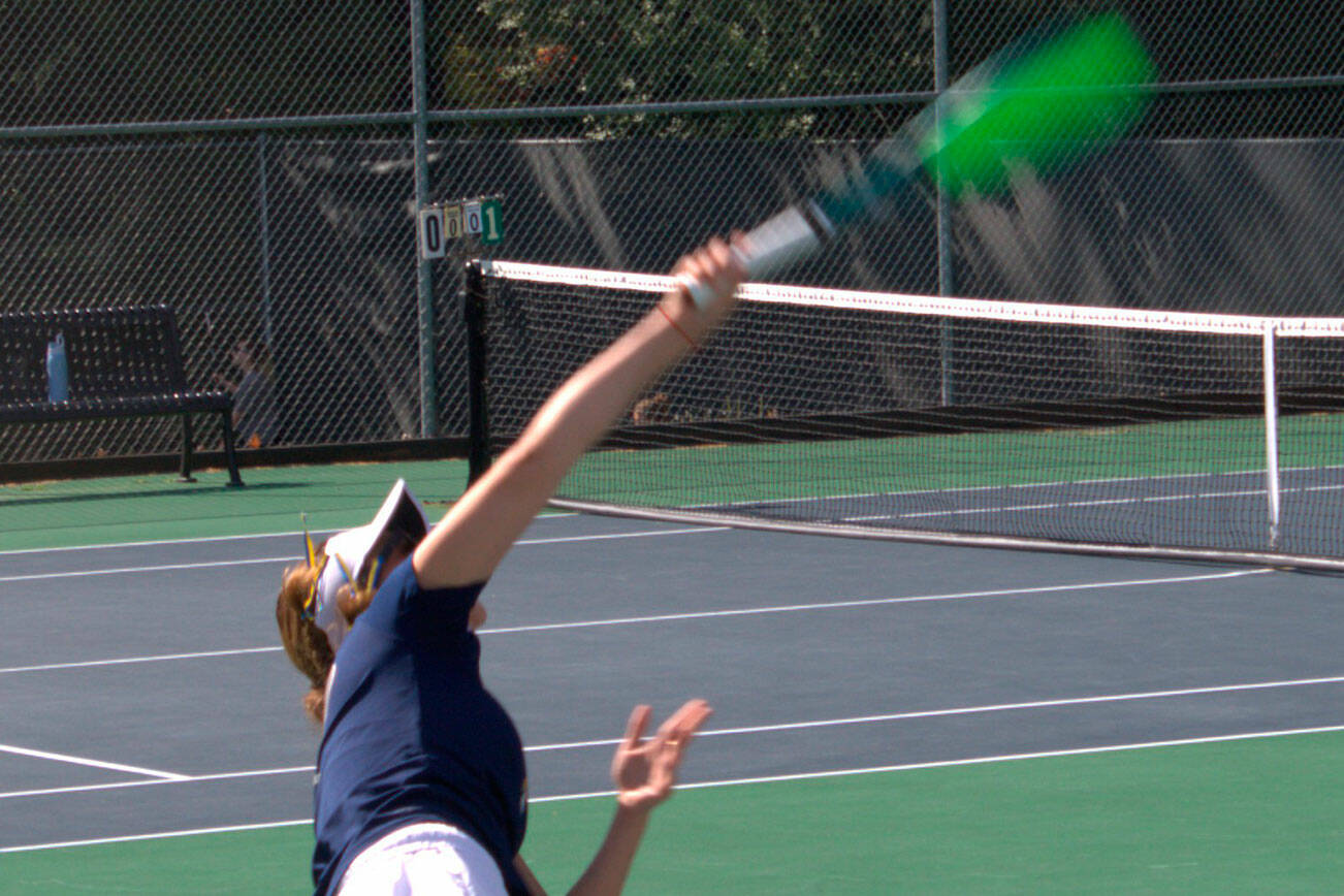 Spartan Elle Schuchman hits a serve in a 6-1, 6-1 singles match loss April 30 at Bainbridge High School.