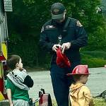 The Bremerton Fire Department passed out firefighter hats to children at the Kitsap Childrens Mobile Museum Day May 3.
