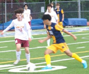 Luke Caputo/Kitsap News Group photos
Spartan Jazz Epstein dribbles the ball with Buccaneer Rocco Thompson pursuing in a 12-0 Bainbridge Senior Night win over Kingston May 2.