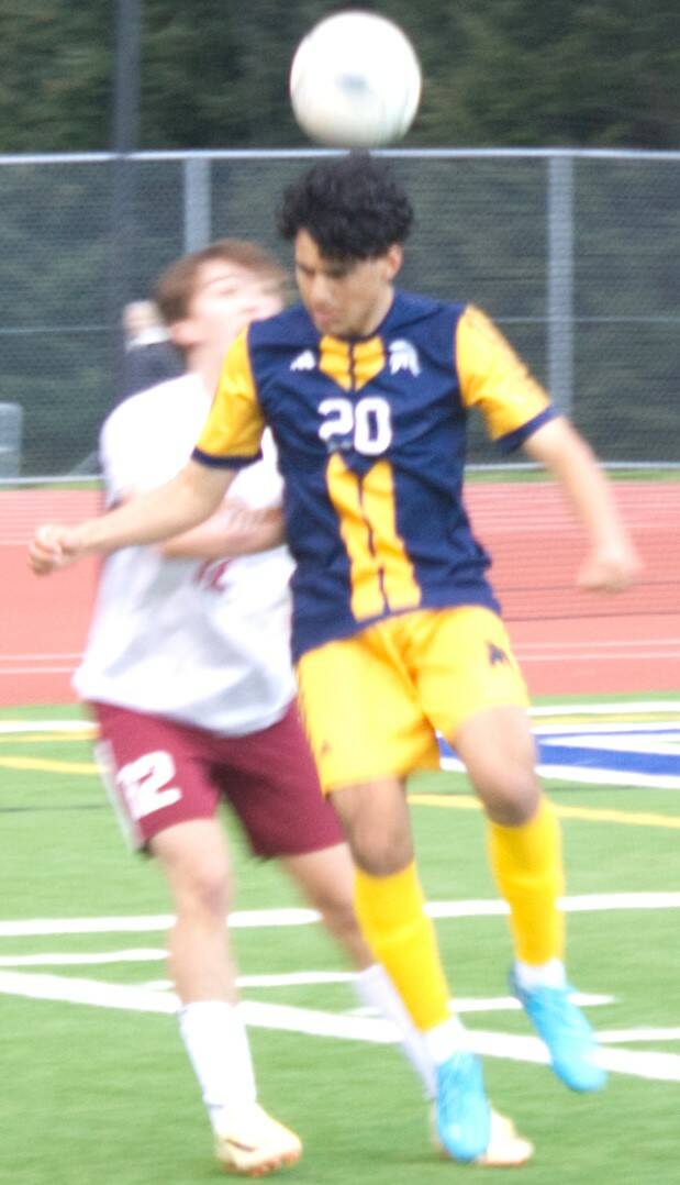 Epstein of Bainbridge keeps the ball away from Buccaneer Harrison Ketenci in a dominant Spartan win over Kingston May 2.